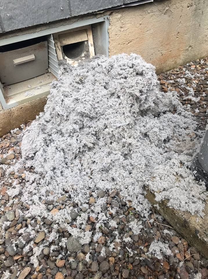 A pile of dirt is sitting on top of a pile of rocks.