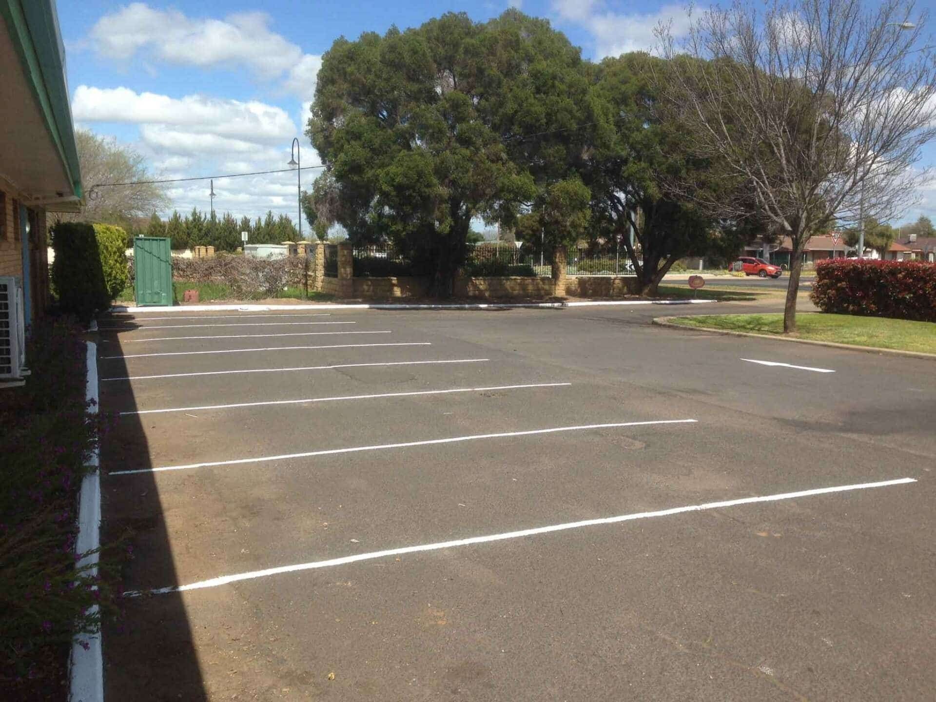 Parking Lot with White Lines, Trees, and Blue Sky — Signvision In Dubbo, NSW
