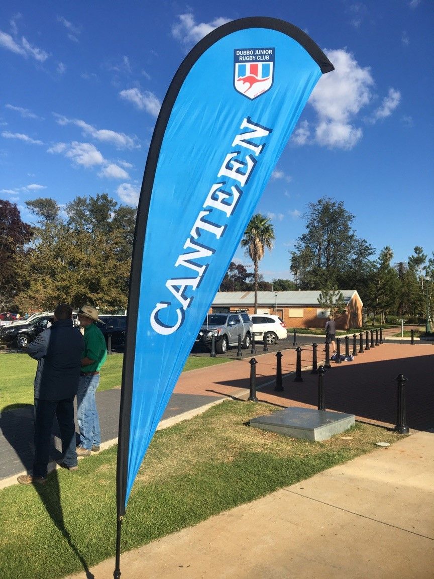 A blue teardrop banner labeled 