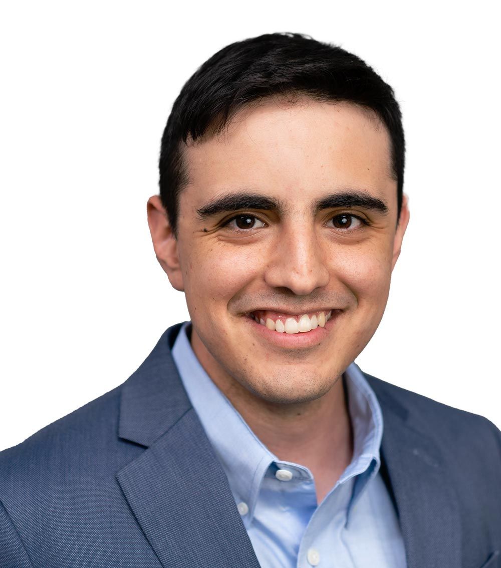 A large building with balconies and hanging potted plants