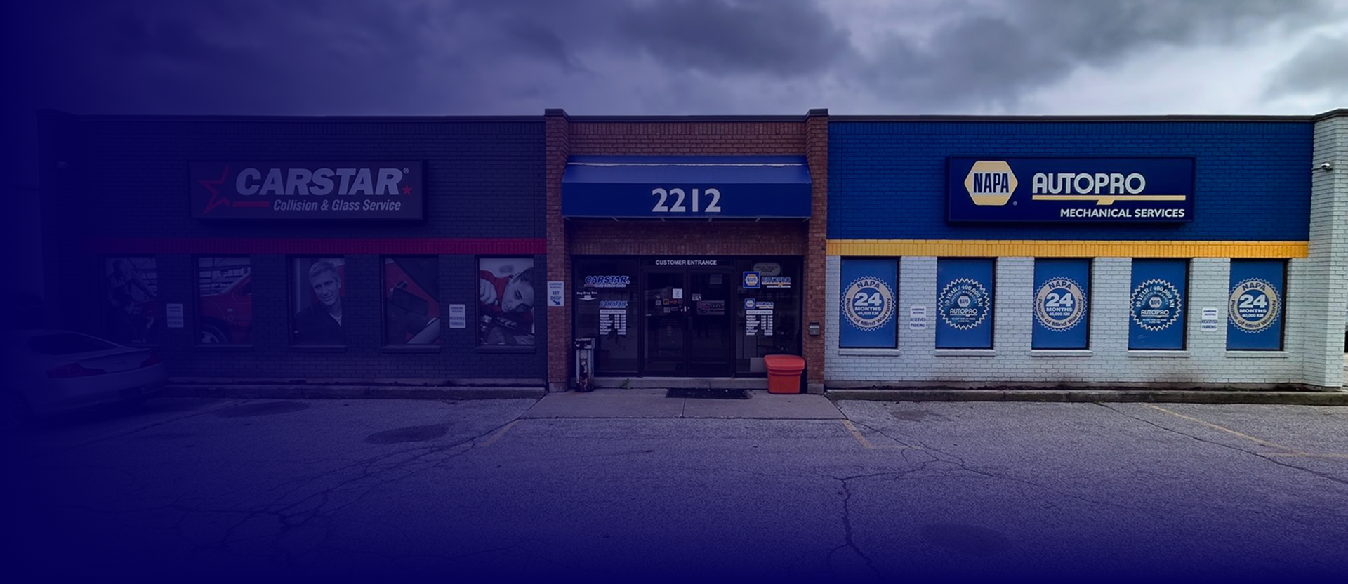 Buildings: Carstar, 2212, and HydroPro storefronts, with signage and a cloudy sky | AUTOPRO Oakville