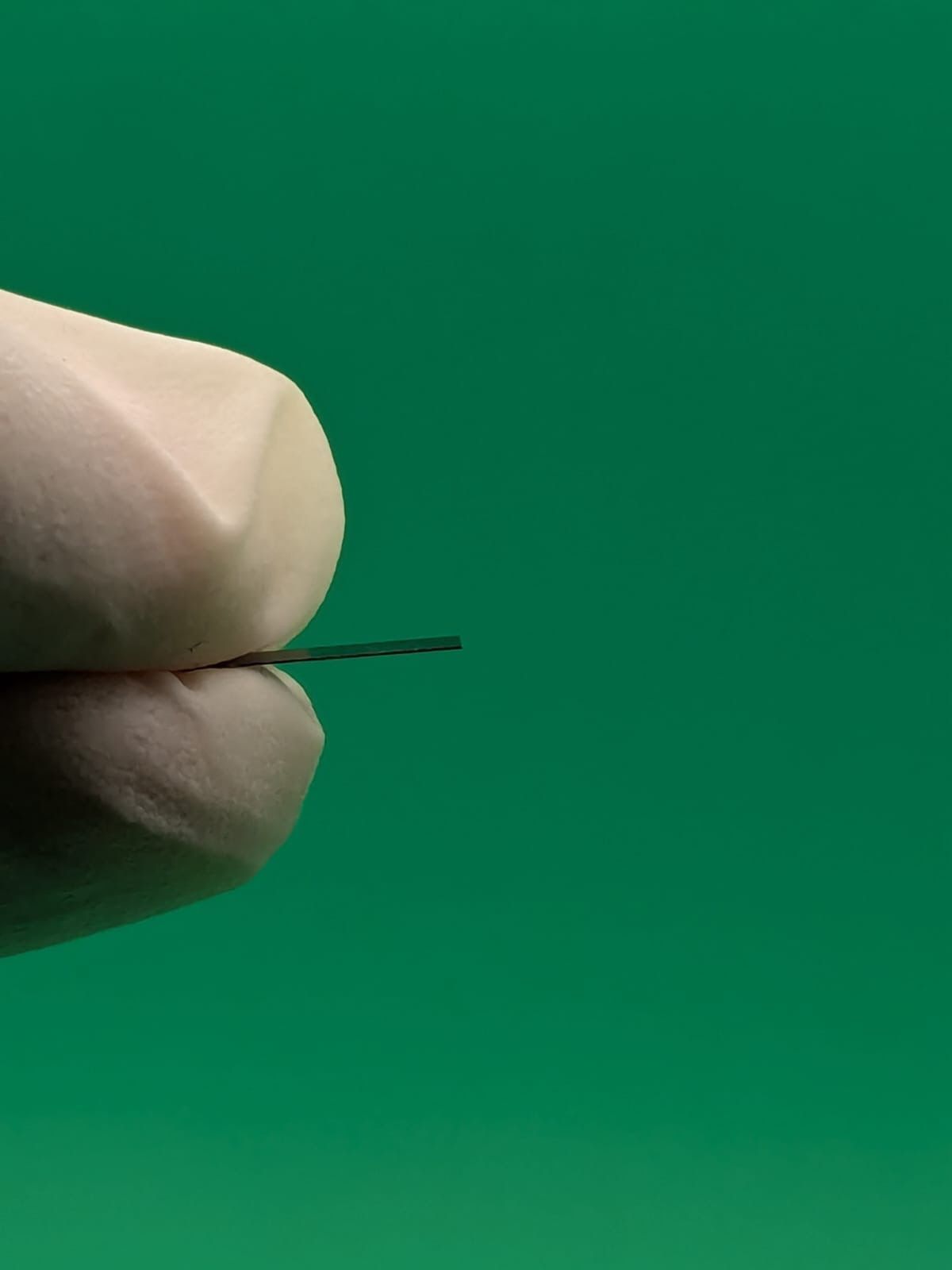 Customer Precision Spacer and Shim held between fingers