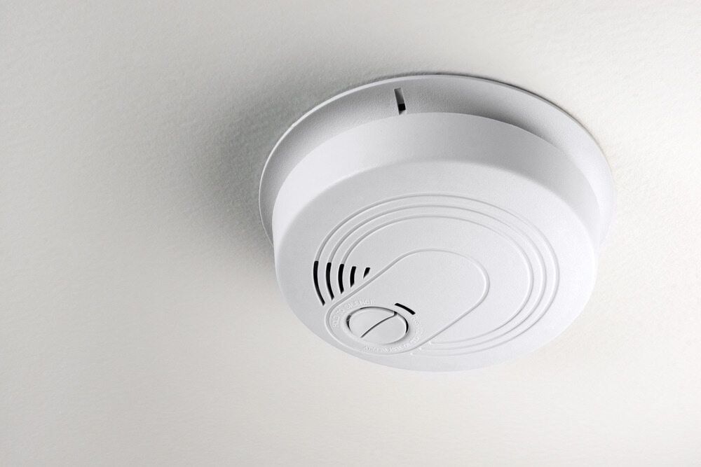 White Smoke Detector Mounted on a White Ceiling — FNQ Smoke Alarms & Maintenance in Herberton, QLD