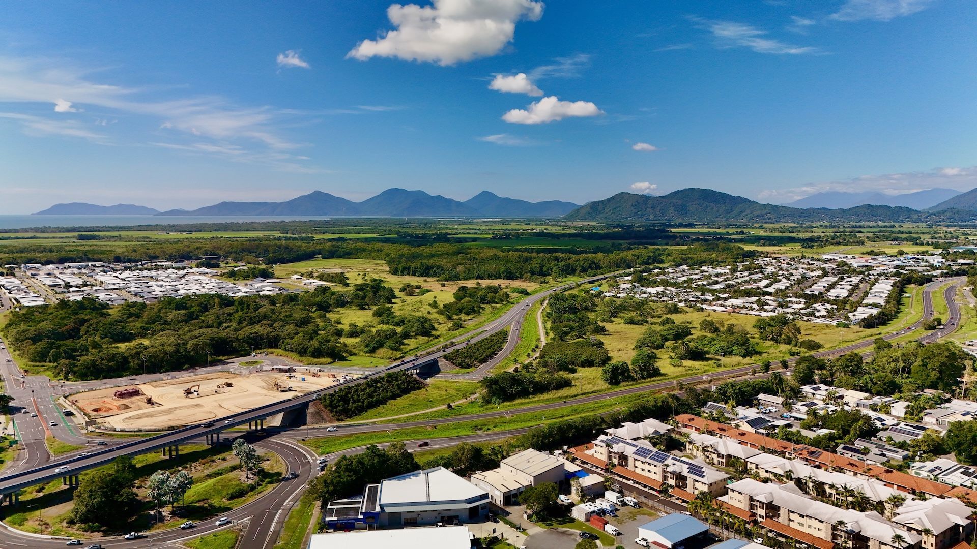 Aerial View of Town With Mountains in the Background — FNQ Smoke Alarms & Maintenance in Smithfield, QLD