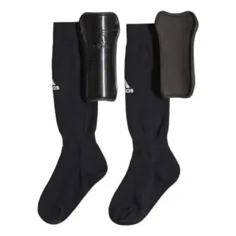 A pair of black socks and a black shin guard on a white background.