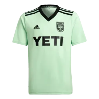 A green soccer jersey with the word yeti on it.