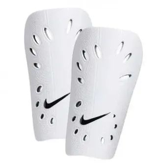 A pair of white nike shin guards on a white background.