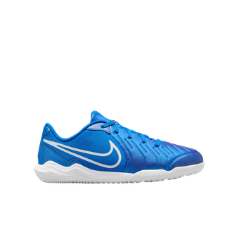 A pair of blue and white nike tennis shoes on a white background.