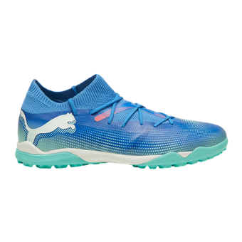A pair of blue and white puma soccer cleats on a white background.