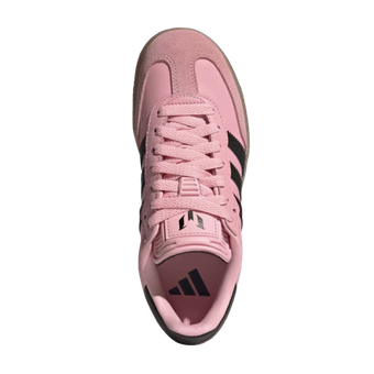 The bottom of a pink adidas shoe with black stripes