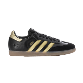 A pair of black and gold adidas samba sneakers