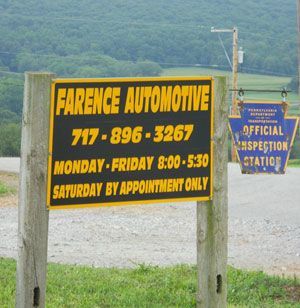 Sign for Farence Automotive, with hours, phone number, and official inspection station sign.