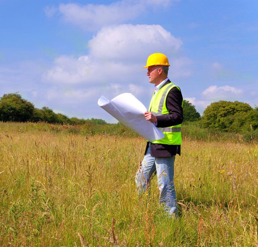 Surveyor on Green Lot — Osborne Park, WA — Cottage & Engineering Surveys