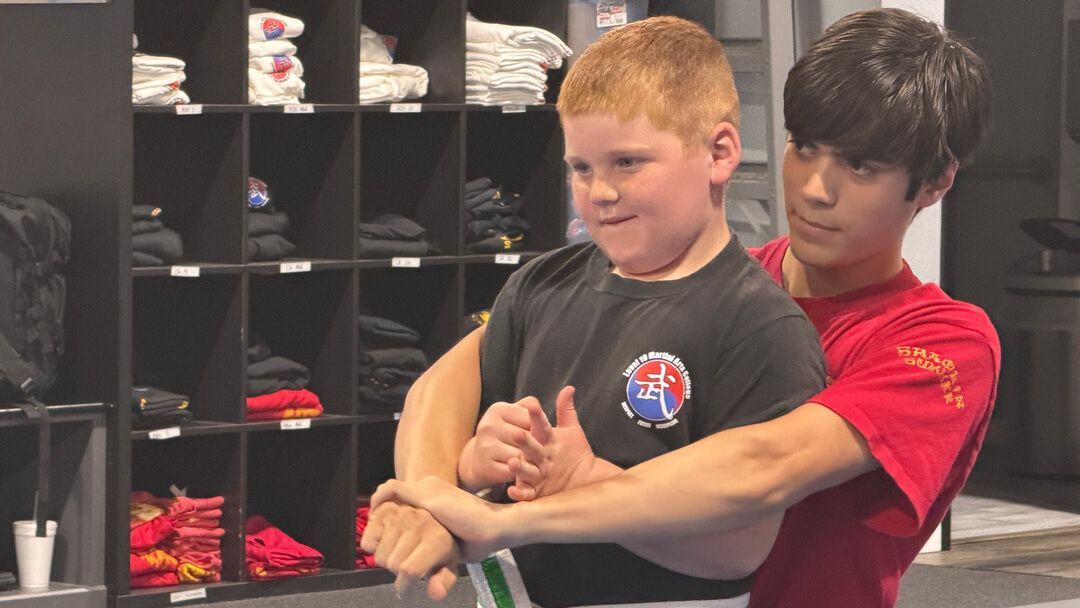 Boy practice self-defense in Palm Harbor.