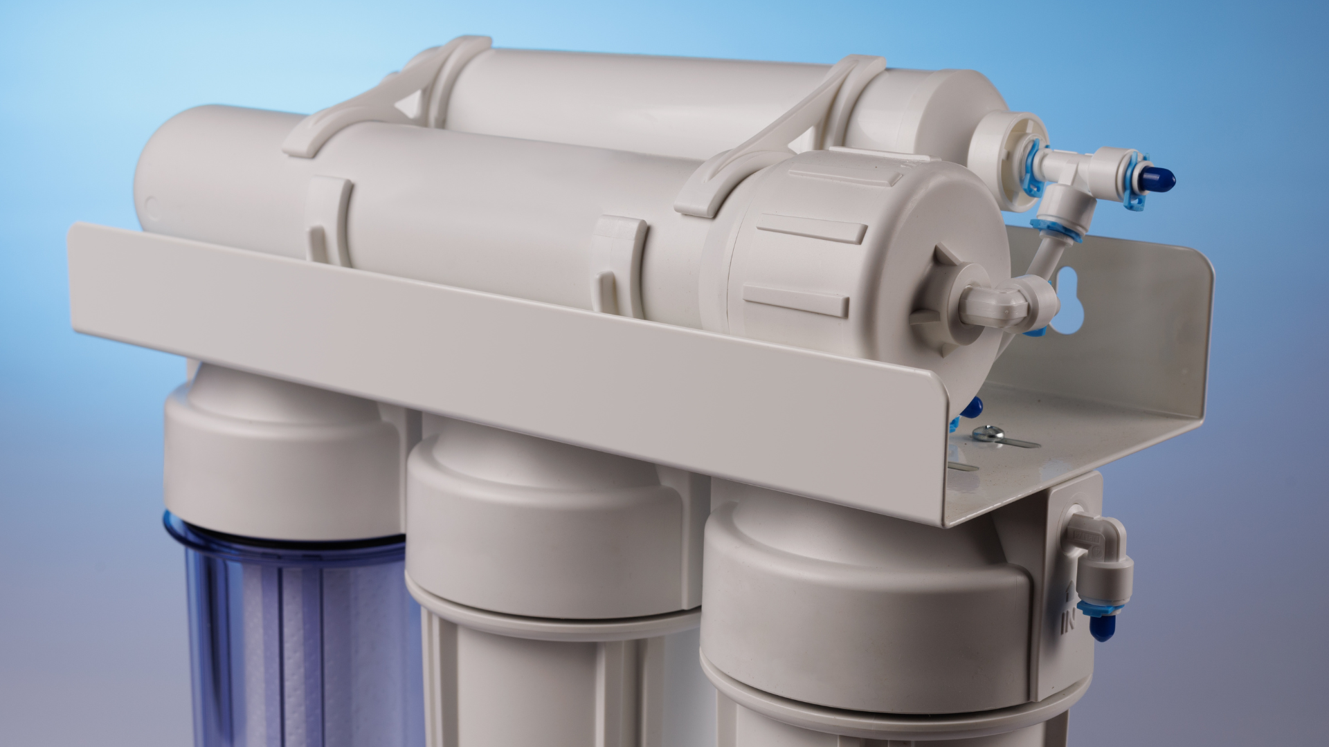 A close up of a water filter on a blue background.