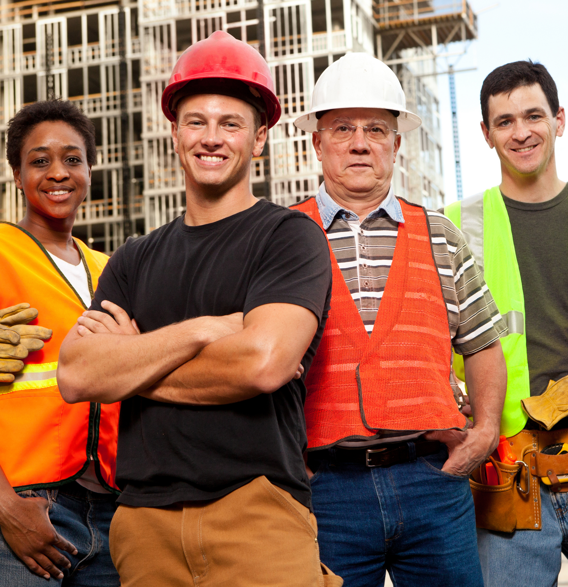 A group of construction workers are posing for a picture