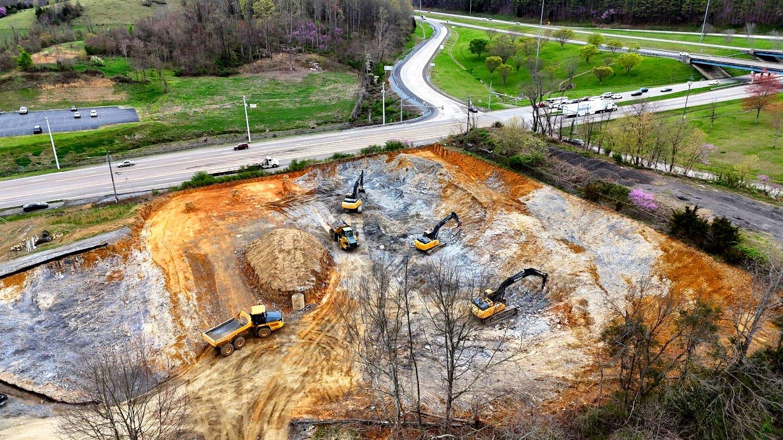 An aerial view of a construction site with a lot of machinery.