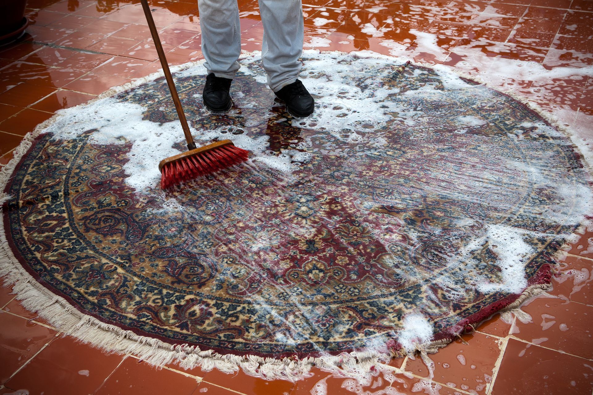 Man Washing A Rug — Adrian, MI — A-1 Clean Sweep