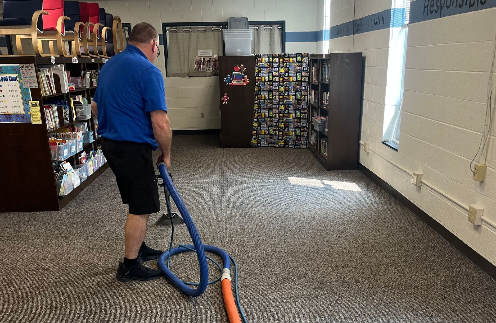Hand Cleaning A Wet Spot On Floor — Adrian, MI — A-1 Clean Sweep