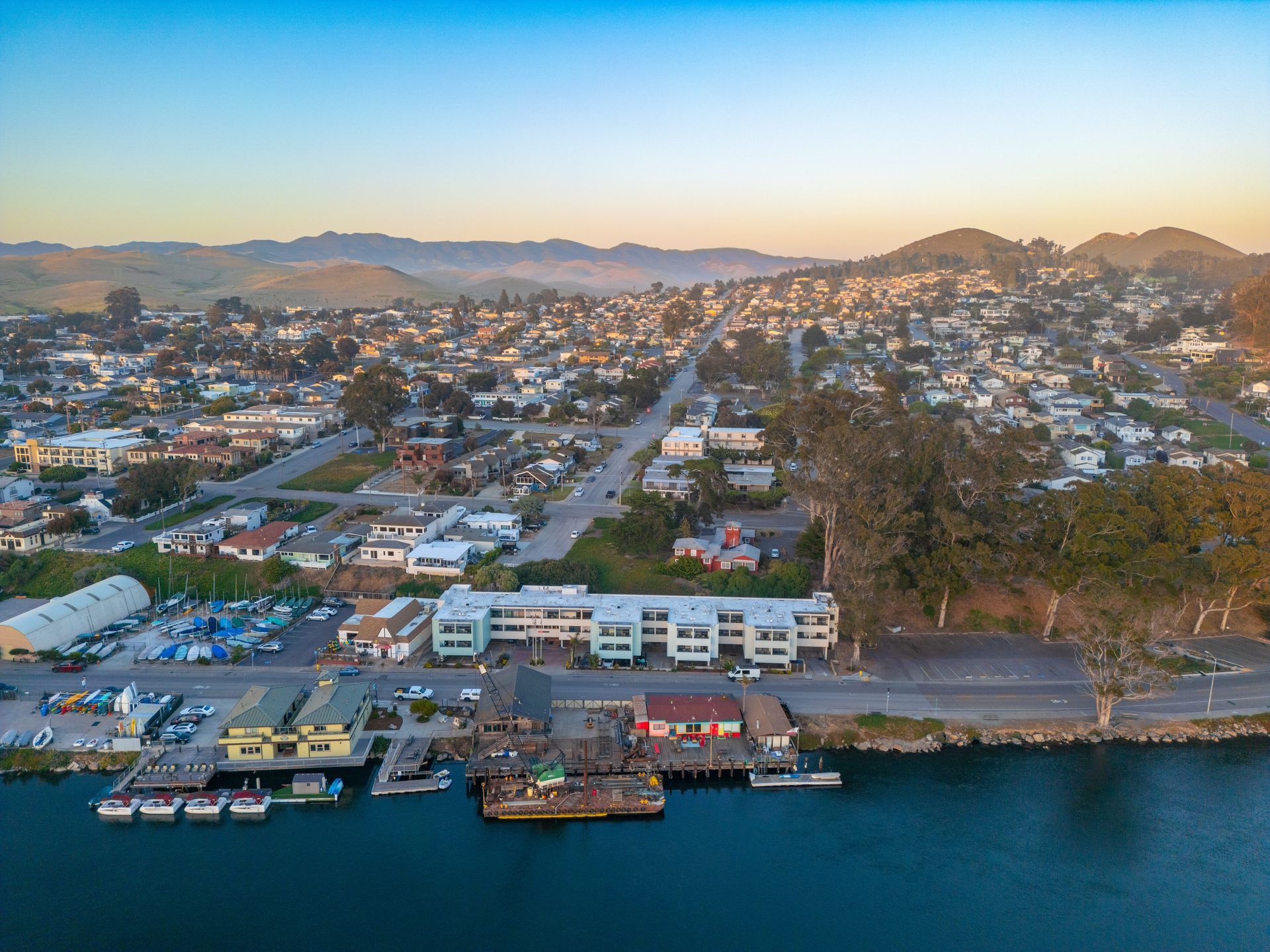 An aerial view of a city next to a body of water.
