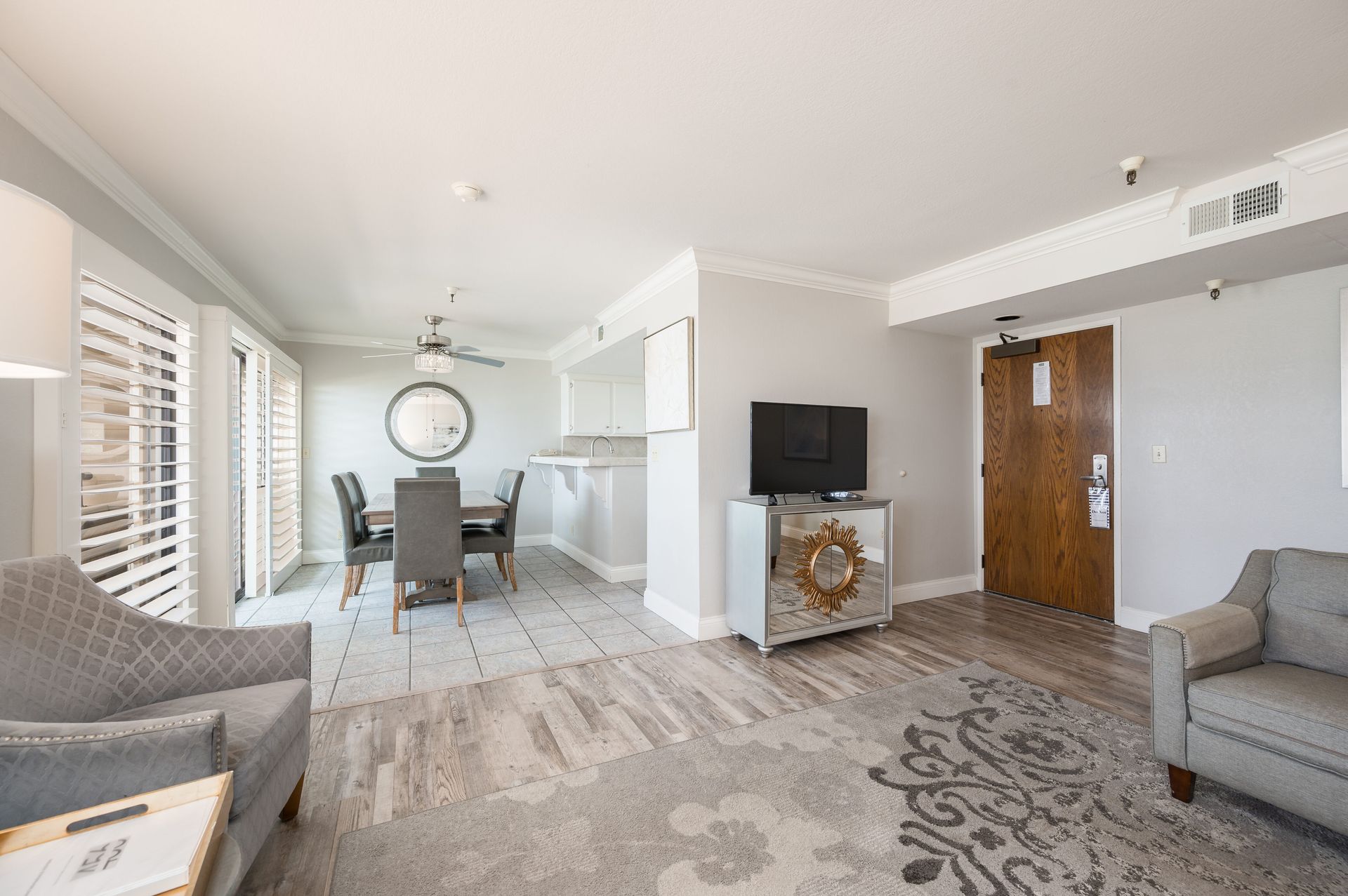 A living room filled with furniture and a television.