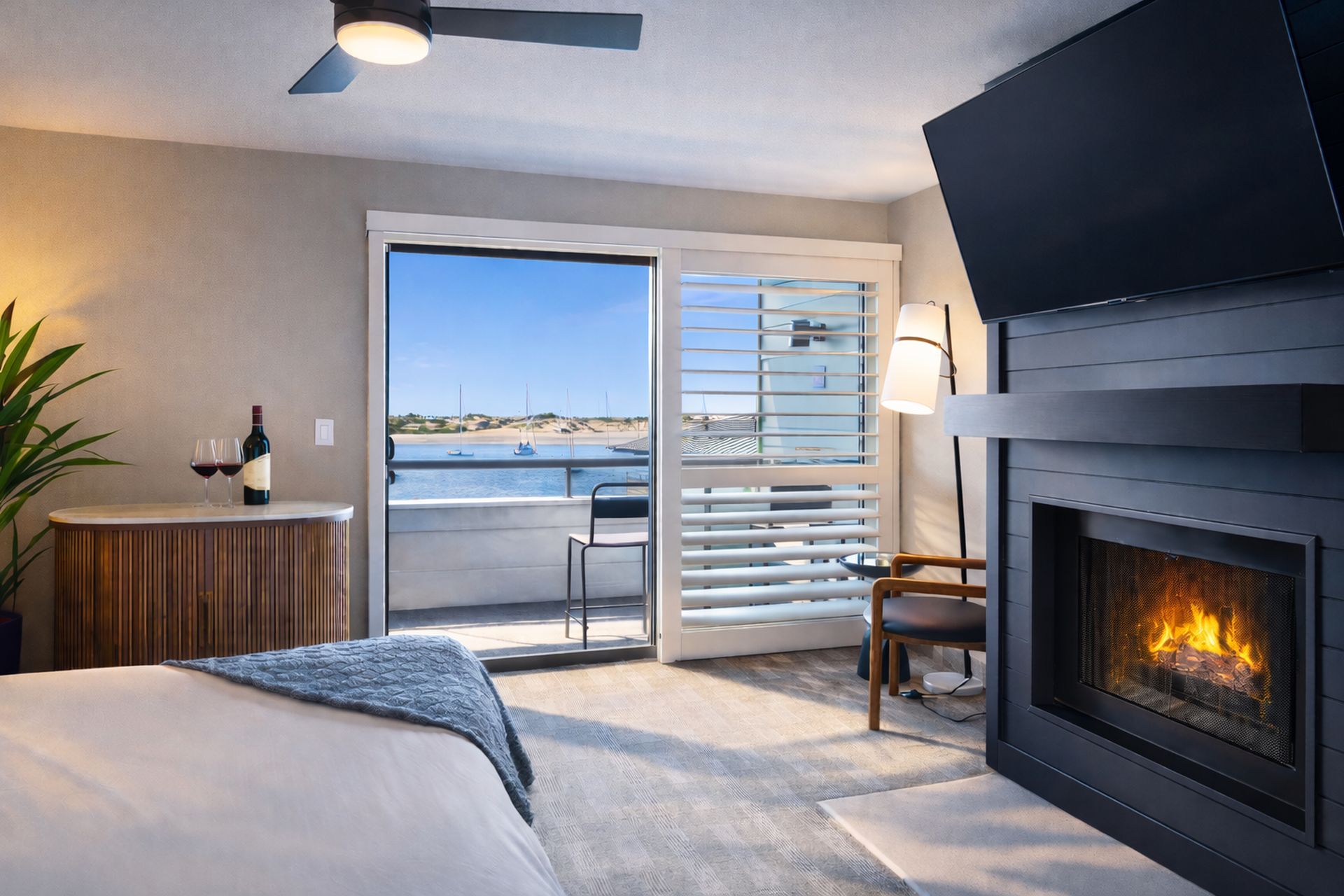 A hotel room with a king size bed and a view of the ocean