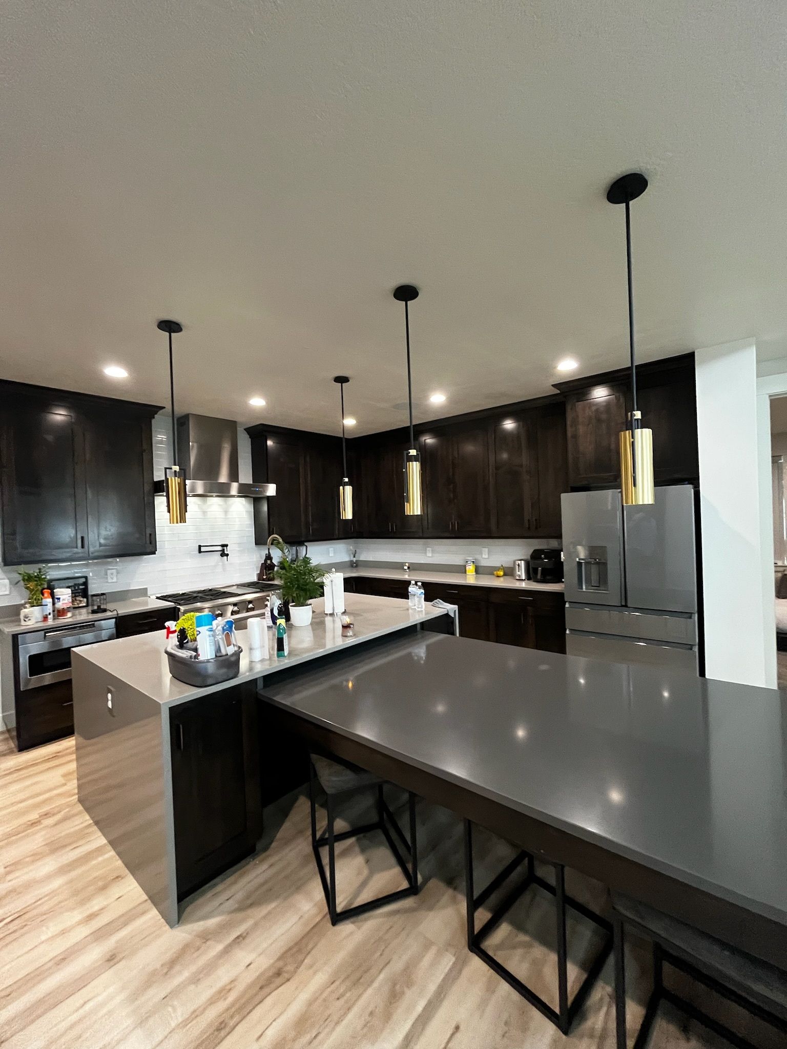 A kitchen with a large island and a table