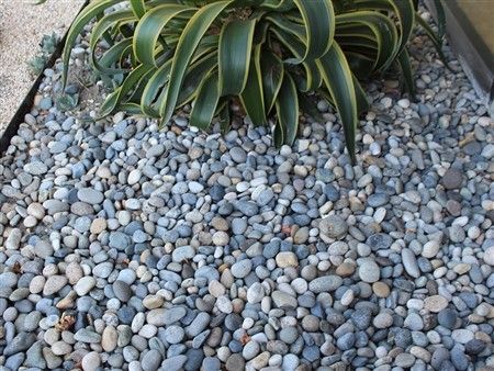A pile of rocks is sitting on the ground.