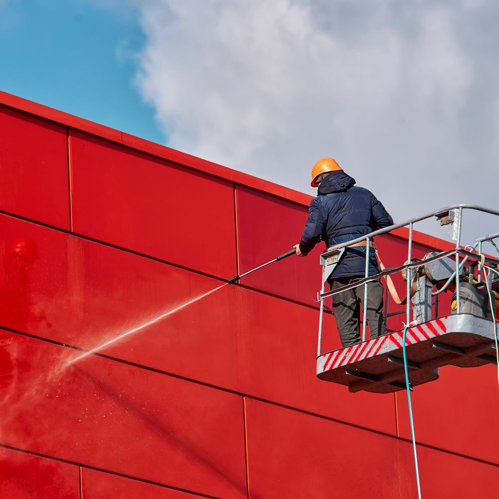 Professional Worker Doing Commercial Building Wall Cleaning