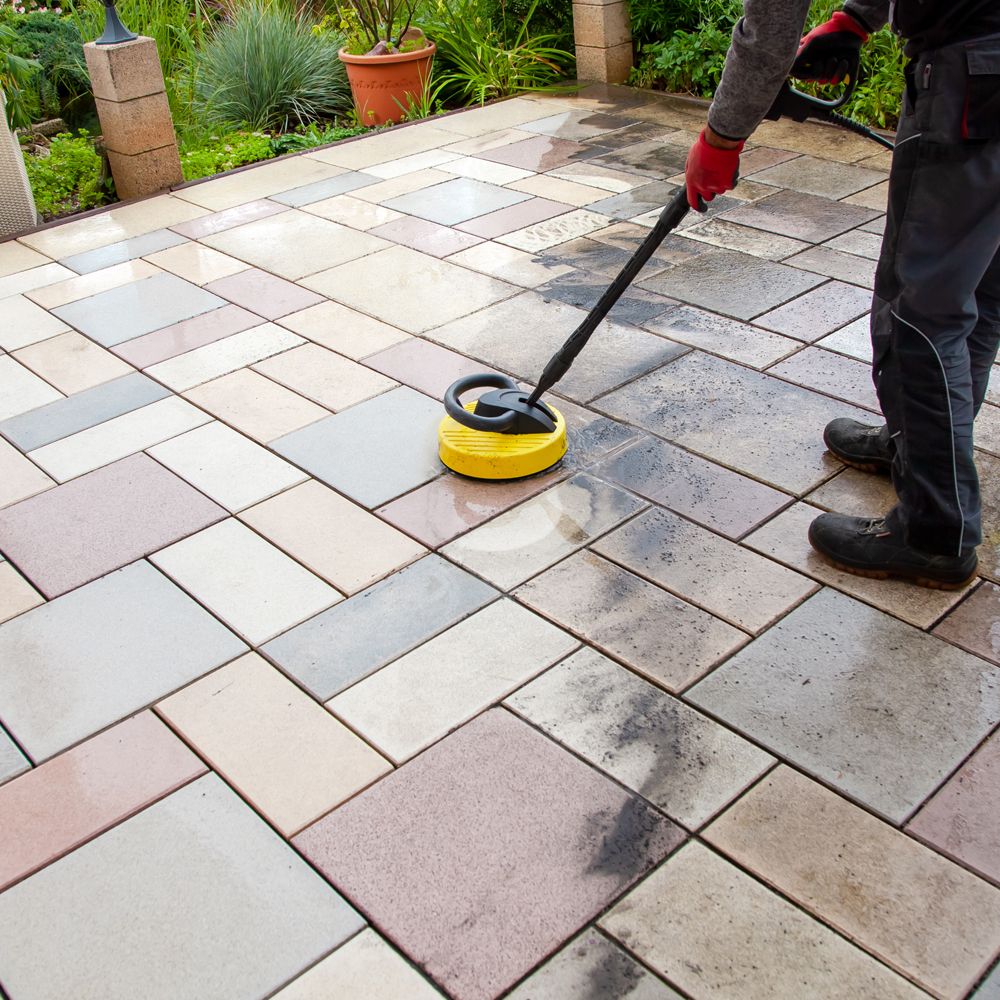 Professional Worker Cleaning Patio