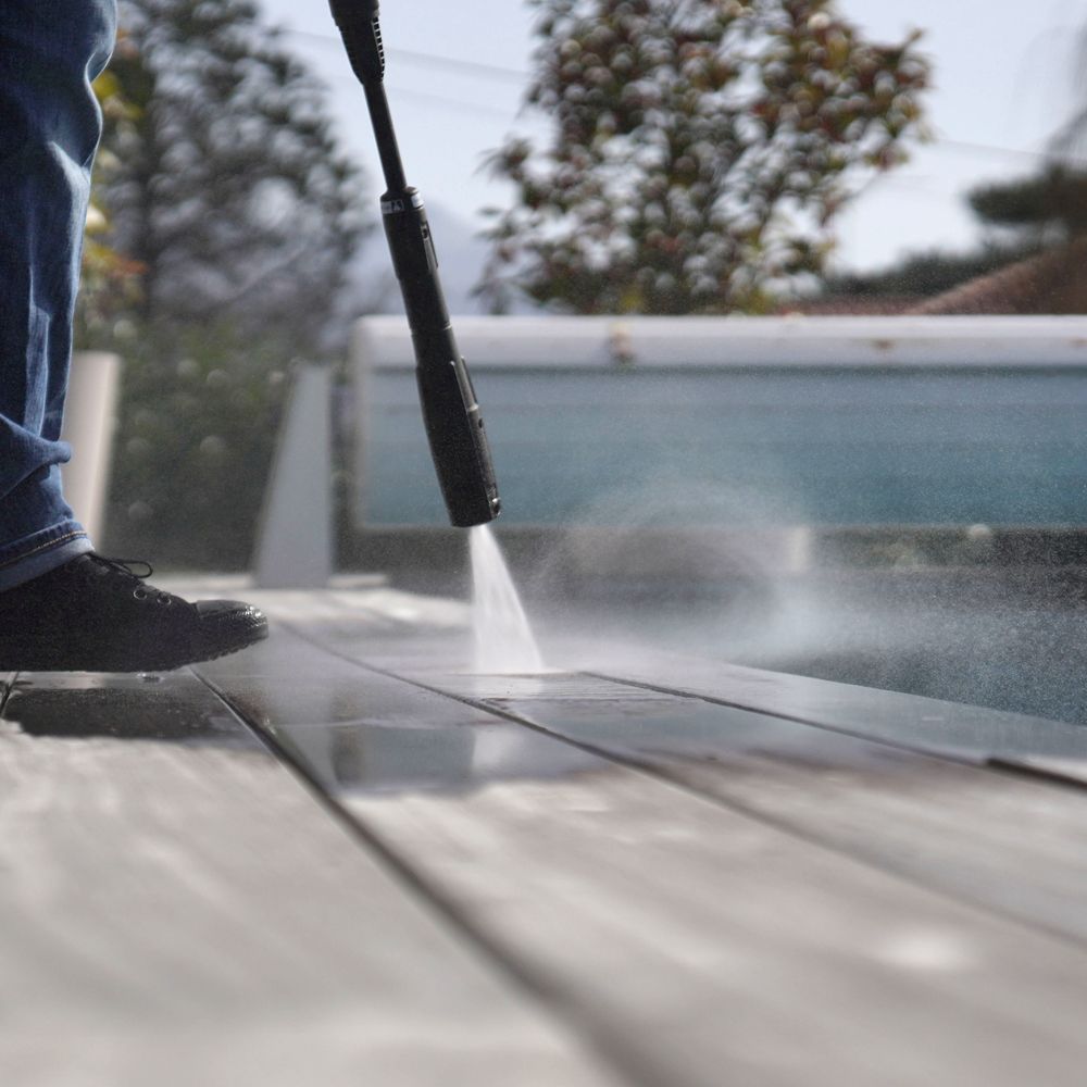 Professional Worker Cleaning Old Pool Deck