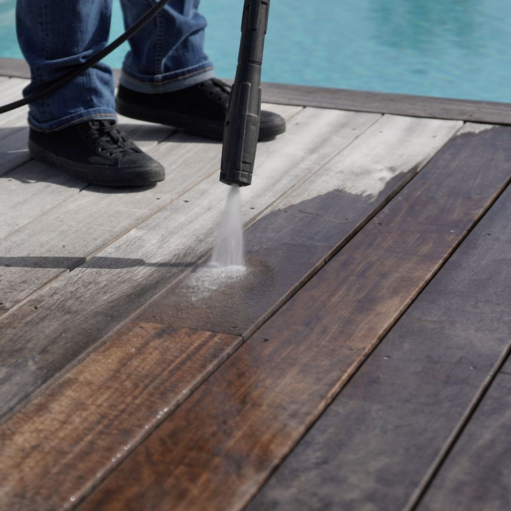 Professional Worker Cleaning a Pool Deck