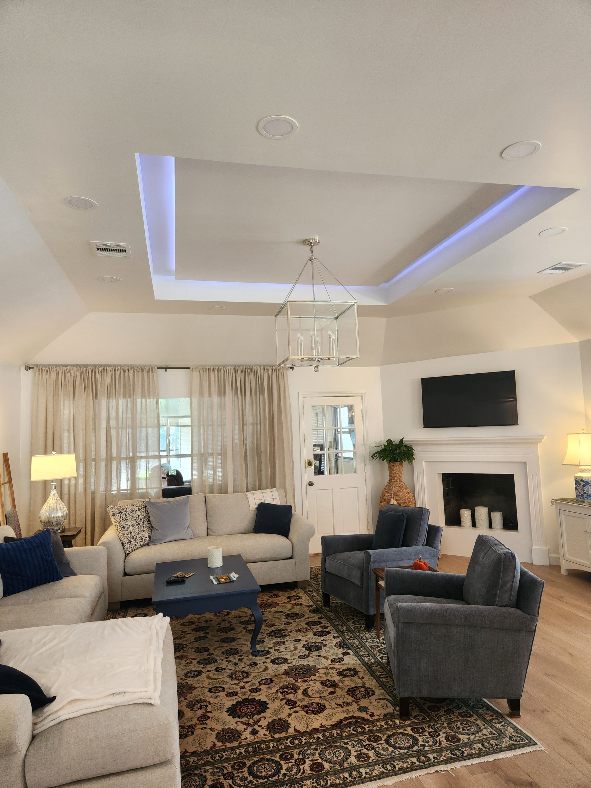 A living room filled with furniture and a fireplace