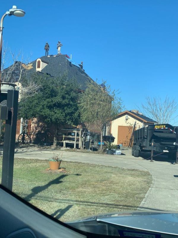 A truck is parked in front of a house that is being remodeled.