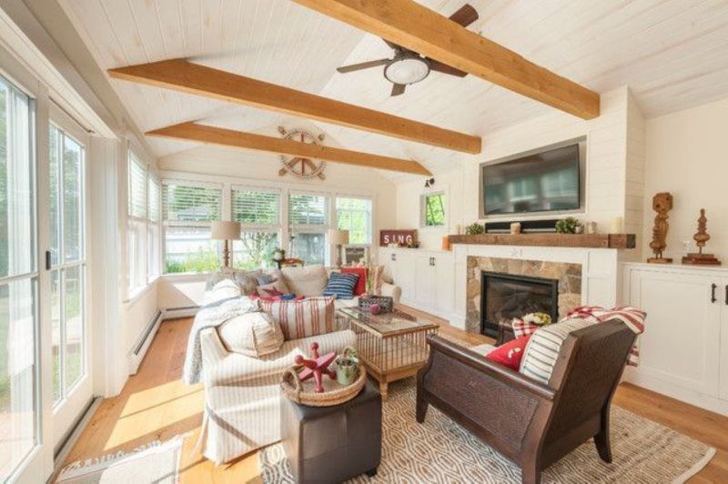 A living room filled with furniture and a fireplace.