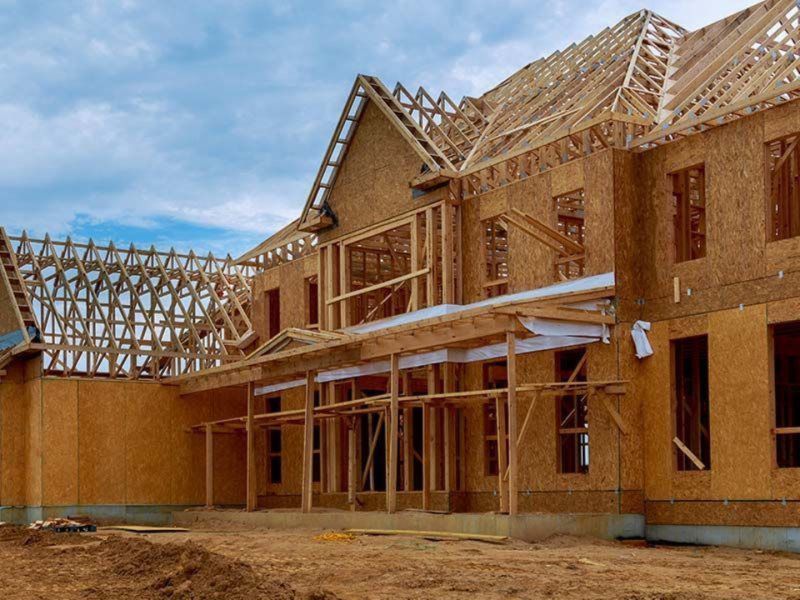 A large house is being built out of plywood