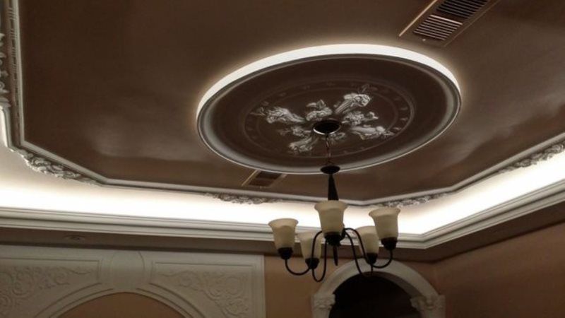 A chandelier is hanging from the ceiling of a room