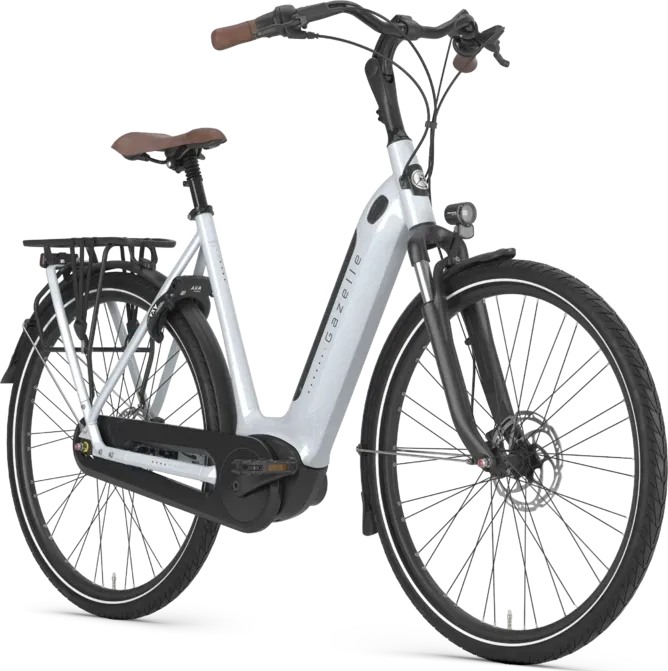 Silver Gazelle electric bicycle with brown seat and handlebars, black fenders, and rear rack.