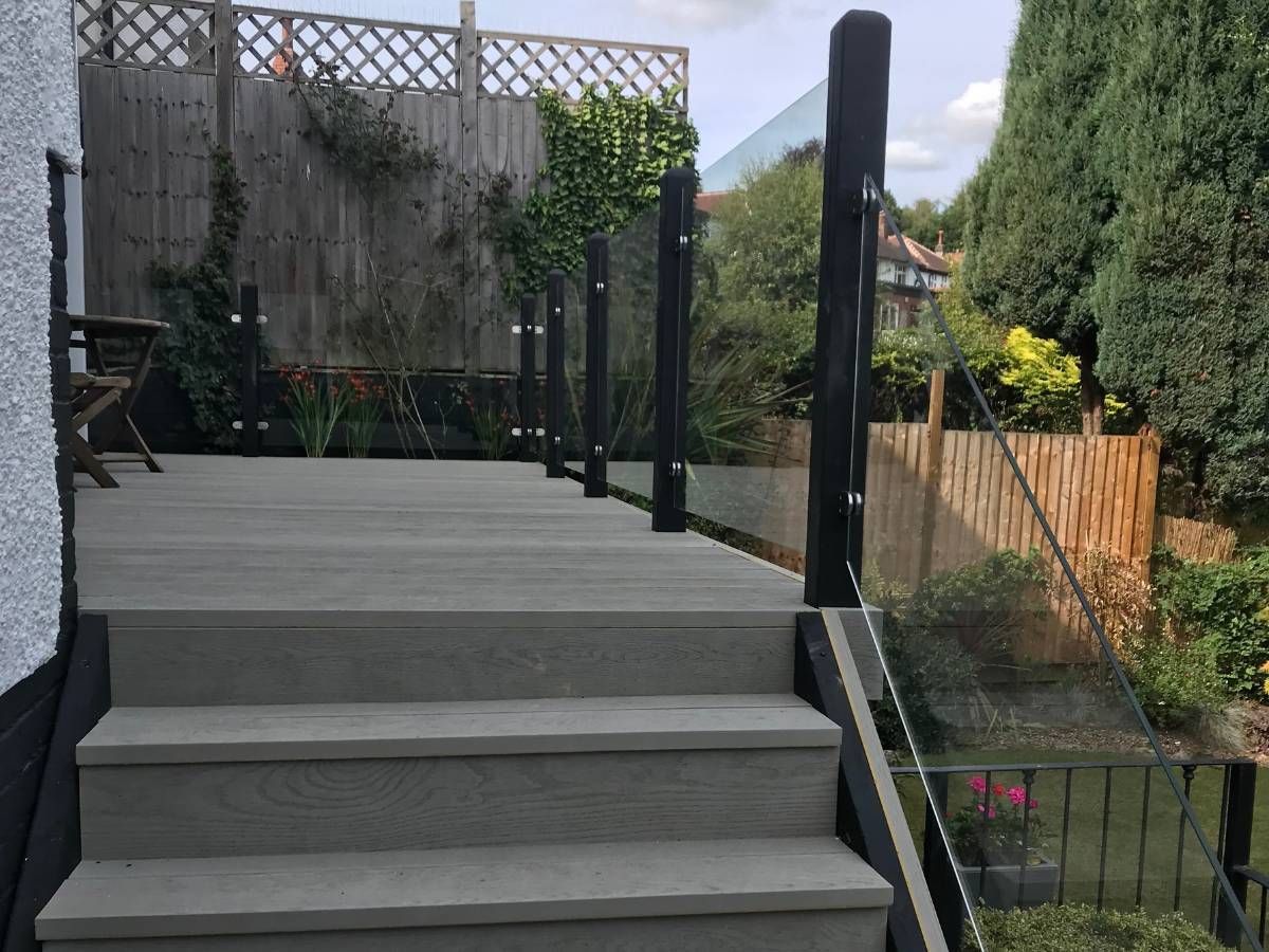 Decking Millhouses glass balustrade with grey composite decking