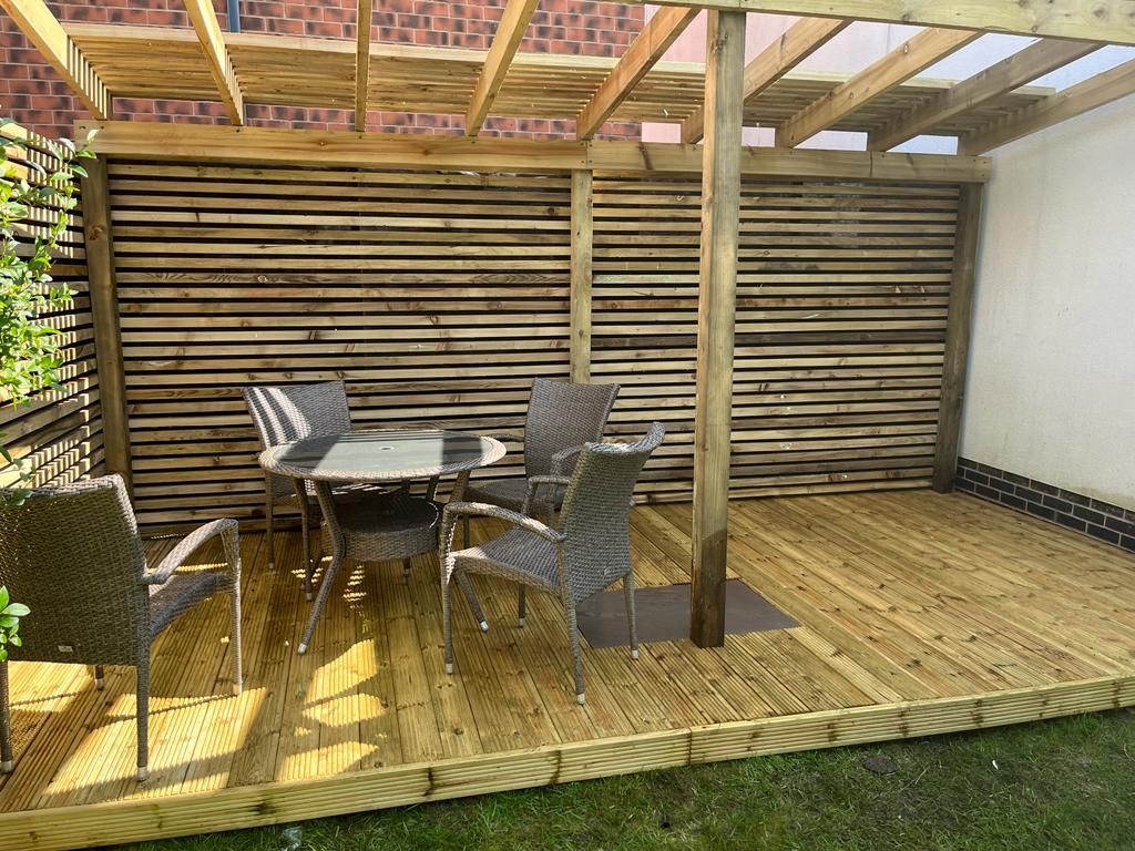 Decking Millhouses timber decking with integrated pergola