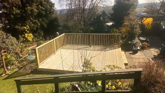 large square timber decking area with balustrades installed in Sheffield