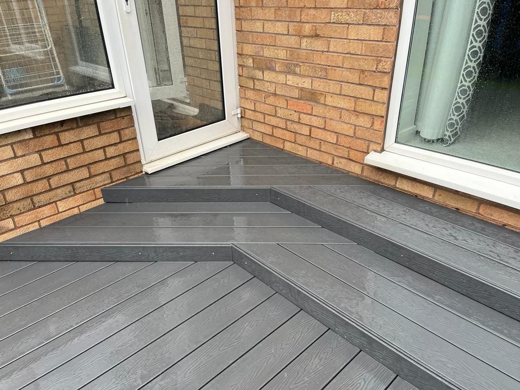 Decking Sheffield raised decking ideas using several steps right to the patio door
