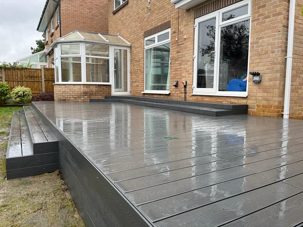 Decking Sheffield large raised decking ideas using central and side steps