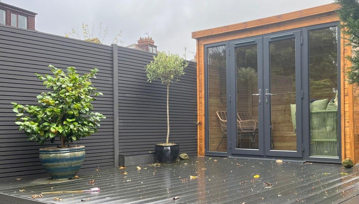composite fencing with matching composite decking along with a garden room all installed by Decking Sheffield