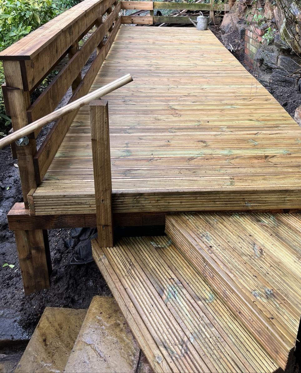 Decking Sheffield decking design to provide steps around and awkward wall