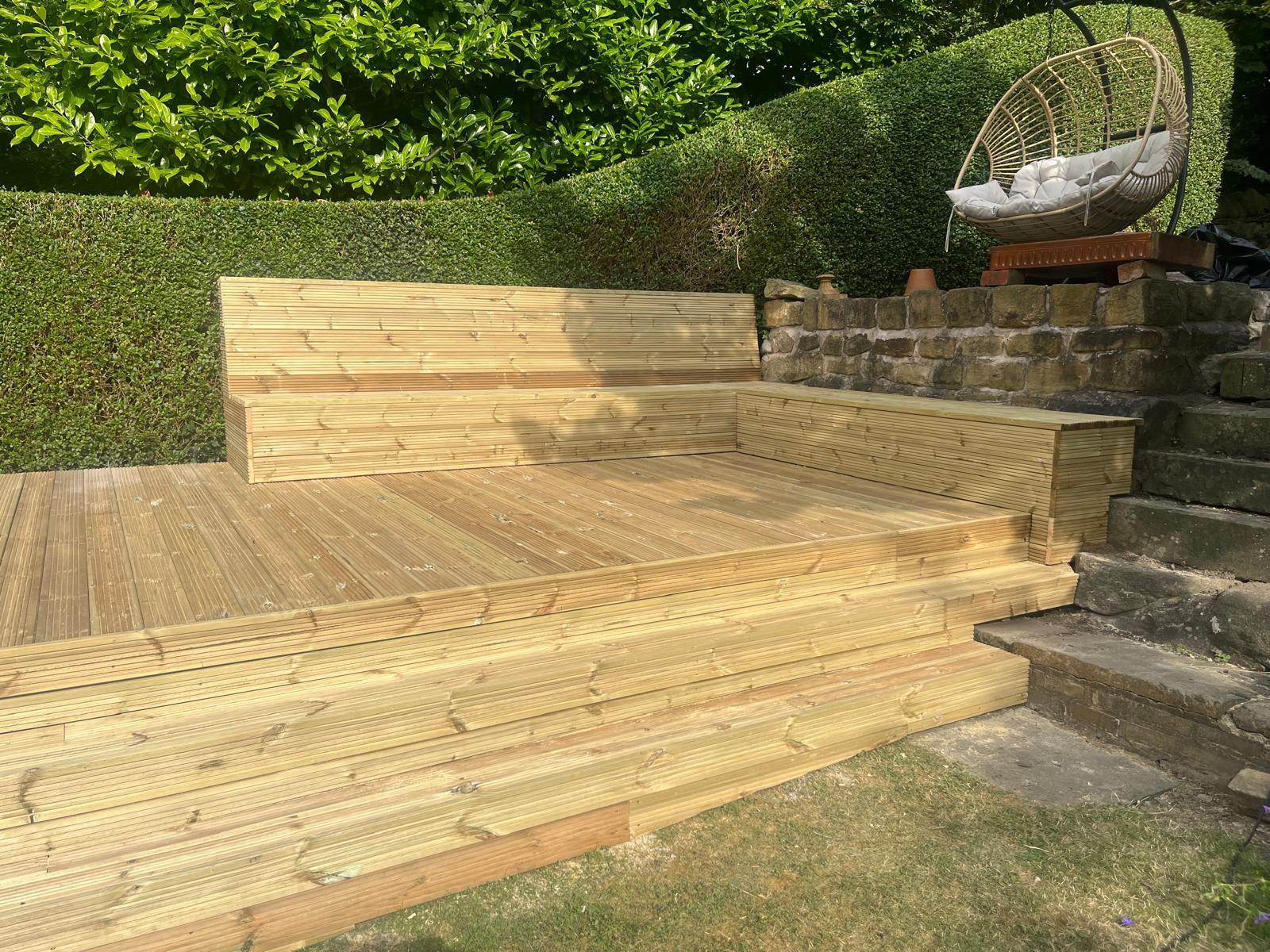 Decking Sheffield timber deck with built in benches. Seating lifts off for storage beneath.