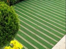 example of layered decking with layer of artificial grass
