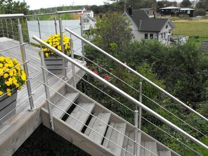 grey composite decking with staircase and wire rail and handrail in Sheffield