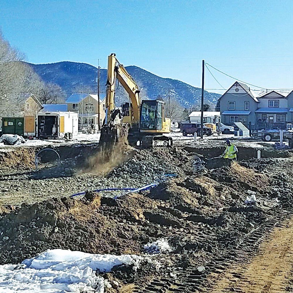 Photo of Excavator moving dirt & rock