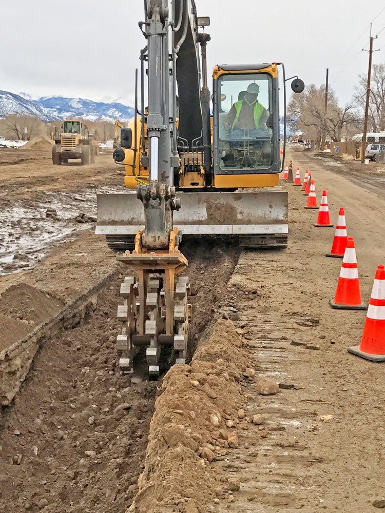 Digging a trench near road.